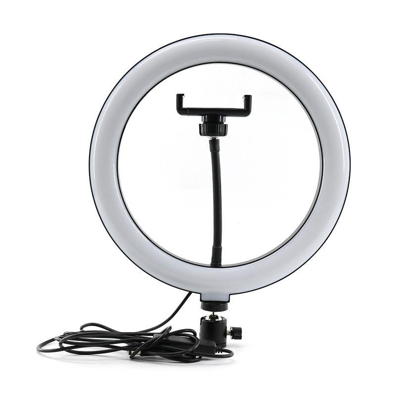 Do you want to be in trends? Do you want to have the coolest pictures and videos?! Buy Ring Light circular lamp, 162 x LED SMD, 3 light levels, wired remote control. It is the ideal pantry for make-up artists, cosmetics, selfies, filming and group photos in low light conditions, also perfect for photographers, bloggers, vloggers.

The product comes with a phone holder, perfect to facilitate filming and make-up photos for artists, bloggers, vloggers and everyone in this industry. Possibility of adapting the make-up mirror or phone or video camera holder.

All makeup artists should have such a Ring Light in their own studio. Its light highlights the beauty of the makeup, being ideal for photos. And it is very important: the pictures for facebook and instagram are perfect! No need for filter or editing either.

General characteristics:

Light source: LED SMD
Lamp type: Circular
USB connectivity
Number of LEDs: 162 pcs.
Tilt at 90 degrees
It is provided with a phone holder
The flexible arm helps to ideally adjust the frame for an optimal position
Thanks to the special SMD LED design, the lamp is light and portable
The color of the light can be selected from the remote control: white, neutral, warm light
Wired remote control for light intensity adjustment (10% - 100%)
LED lifetime: 50,000 hours
Color temperature: 2700K-4100K-6500K
Supply voltage: 5V DC
Outer diameter: 29.5 cm
Inner diameter: 23.5 cm
White color.
Cable length: 195 cm
Note: The lamp includes a phone holder.
Attention: The lamp is only powered by USB, it does not have a power supply for the socket
Packaging: box 1 pc.